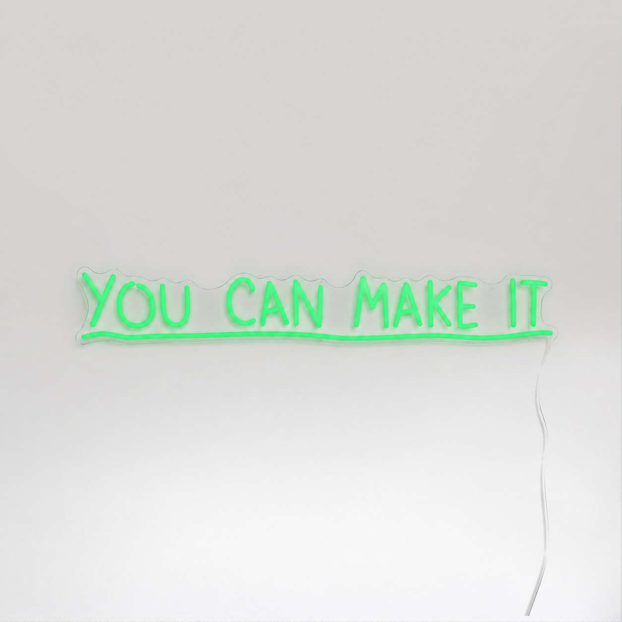 Néon LED You Can Make It vert sur mur blanc