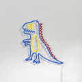 Néon LED Big T-Rex Kid en forme de dinosaure dessiné, bleu jaune rouge, sur mur blanc